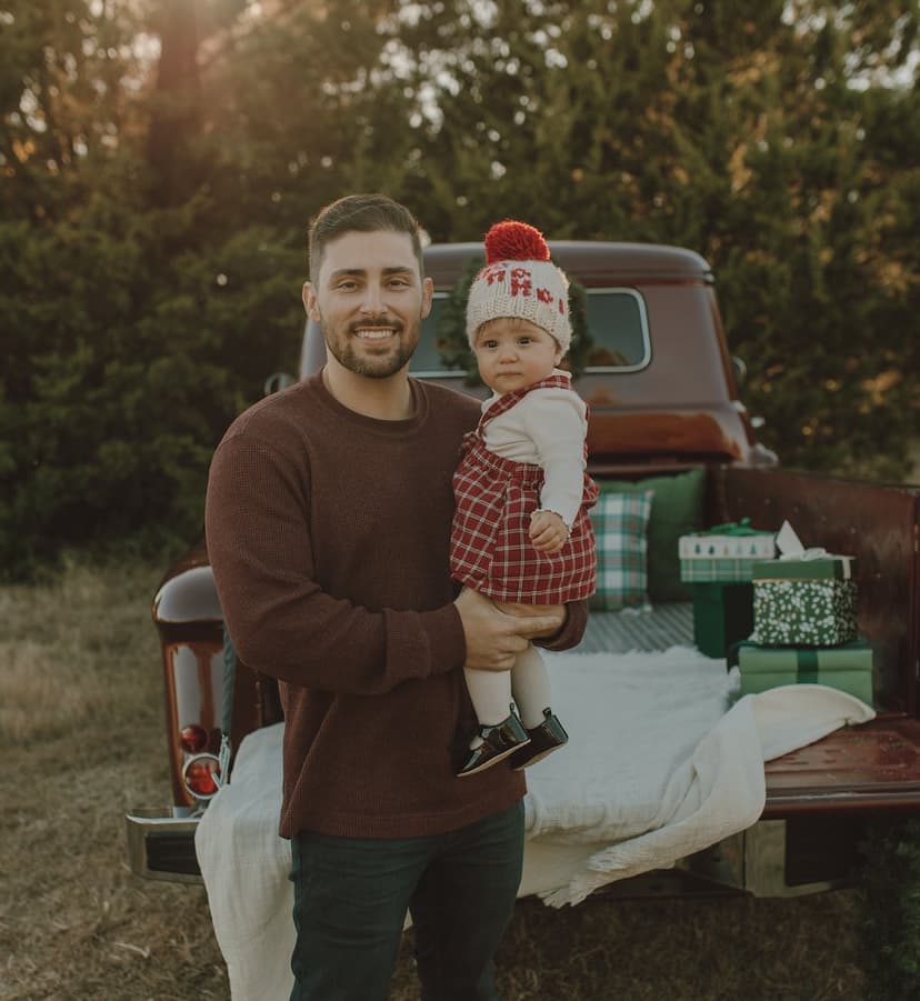 Adam holding his daughter